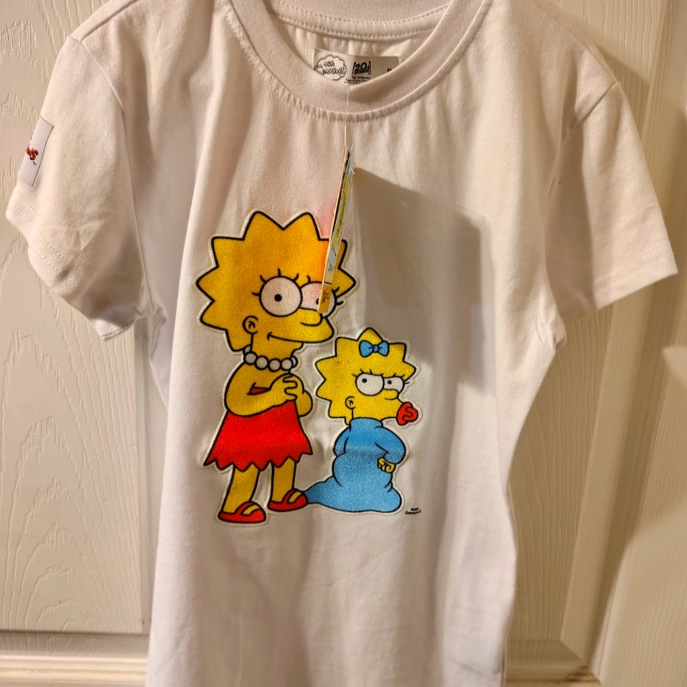 The Simpsons unisex graphic tee. Size M 10/12 BRAND NEW W/ TAGS! Citi Trends!
